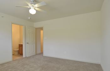 Bedroom with white walls and a ceiling fan at The Pointe at Manorgreen Townhomes, Maryland, 21220